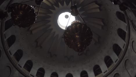 interior shot of ancient israeli building, with a high domed, very decorated ceiling