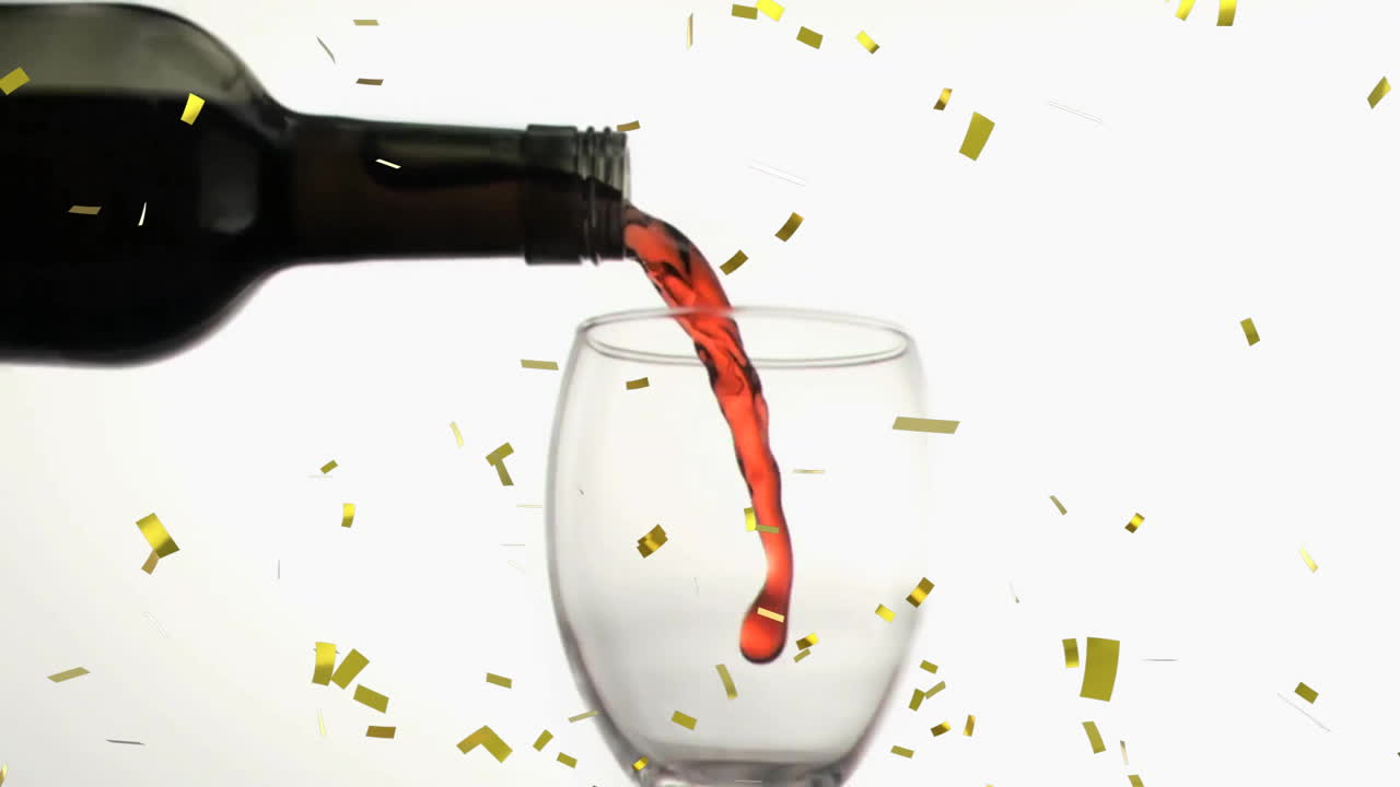 Animation of confetti over glass of red wine on white background