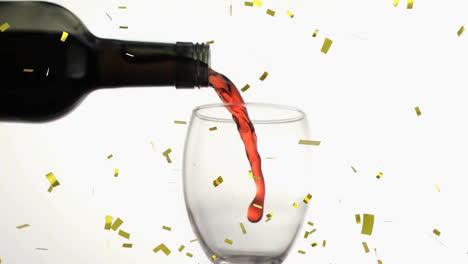 animation of confetti over glass of red wine on white background