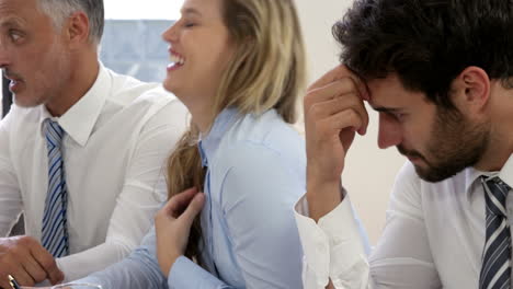 upset man during a meeting is shaking his head