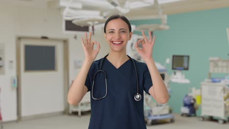 happy indian female doctor showing okay sign