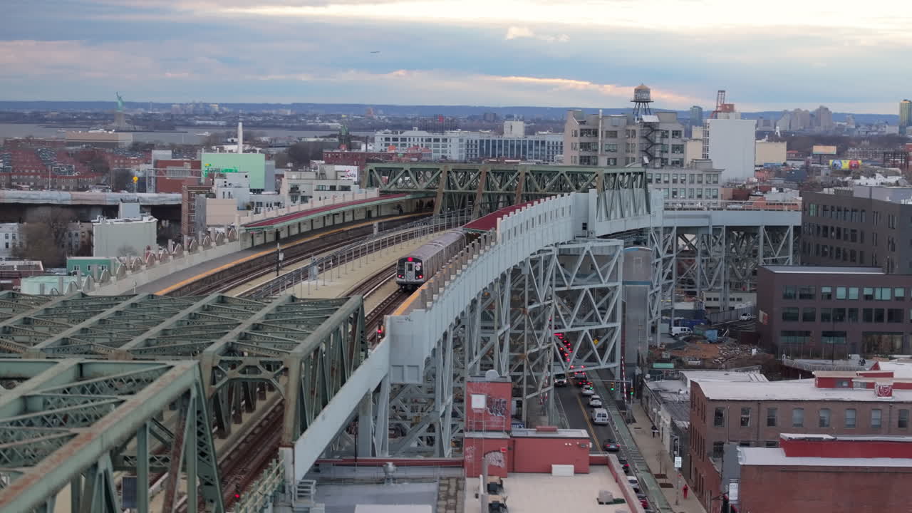 Aerial view of the subway on an elevated railway track in Brooklyn. Shot on an overcast day in Gowanus.