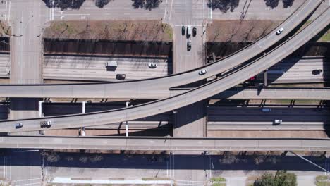 birdseye aerial view, traffic on american highway interchange and junction, top down drone shot