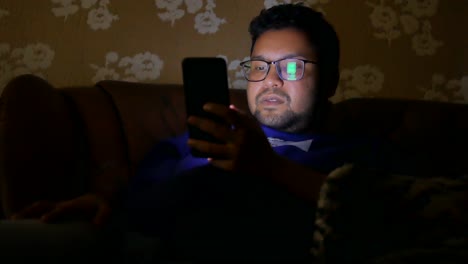 man using a smartphone at night