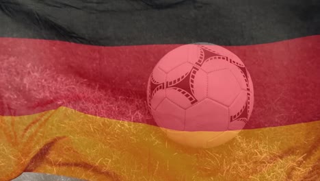 animation of flag of germany and football over stadium