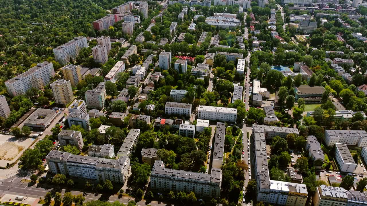 Cinematic aerial perspective of Warsaw Poland urban residential blocks in summer