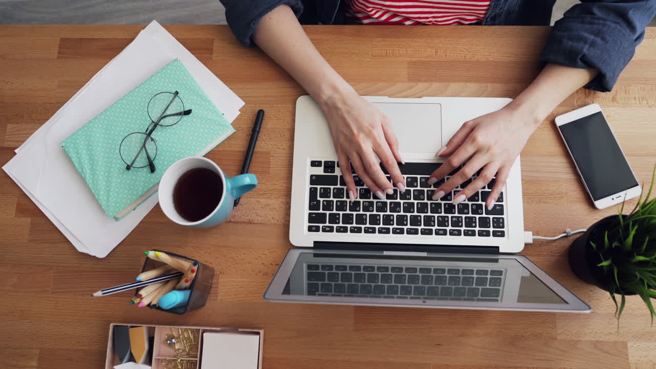 Woman Working on Laptop at Home Office Desk