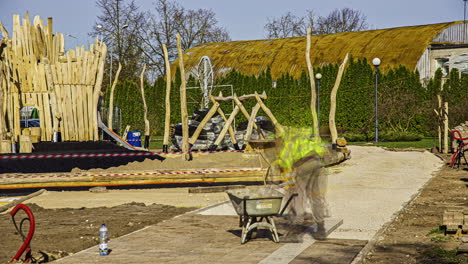 timelapse shot of workers constructing sidewalk with concrete pavement tiles in a playground on a bright sunny day