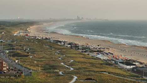 aerial view of katwijk town with coastal dunes and stretch of beach, netherlands