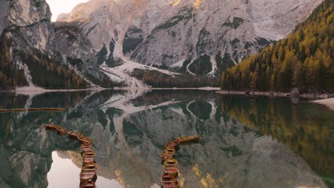 drone flies over famous lake braies, italy