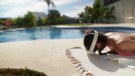 girl wearing vr headset by the pool