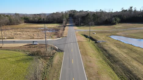 traveling down a rural two lane road with vehicles passing by