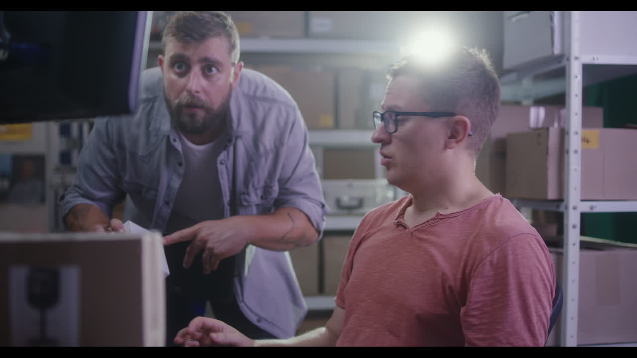 Two men working in a warehouse