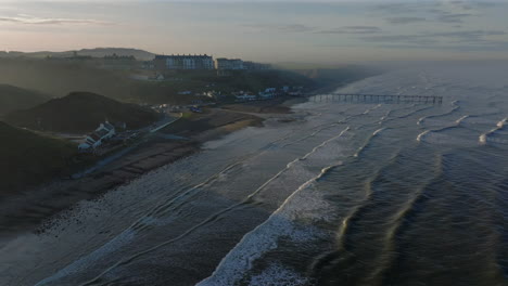 establishing aerial shot of saltburn-by-the-sea looking up the coast uk