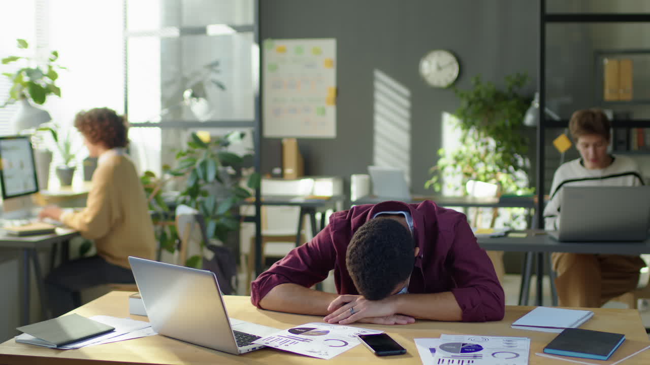 Timelapse of Office Worker Sleeping on Desk