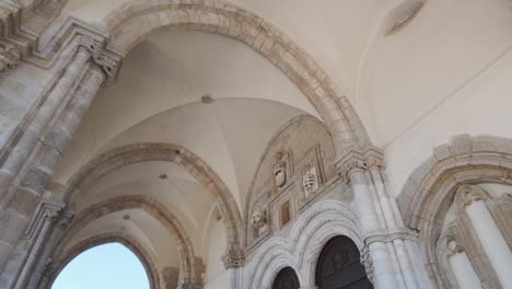 architectural details of the gothic sao francisco church entrance in evora, portugal, bathed in sunlight