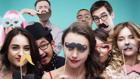 Multi-racial-group-of-funny-people-celebrating-slow-motion-party-photo-booth