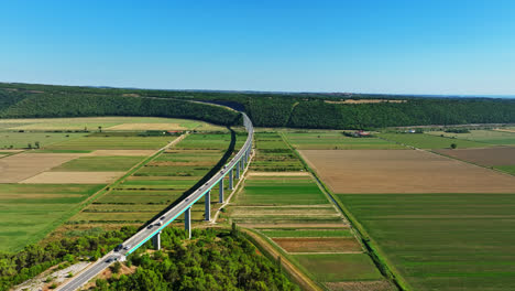drone flying along the viadukt mirna bridge, sunny day in istria, croatia