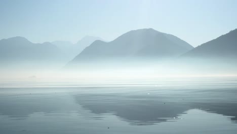 foggy morning low angle pan shot of kotor bay - montenegro-1