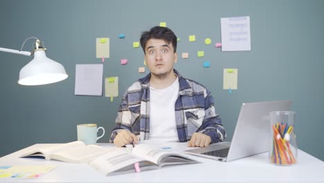 male student experiencing joy looking at camera.