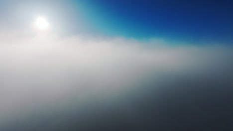 dreamlike morning flight into mist as riga’s skyline fades into the clouds