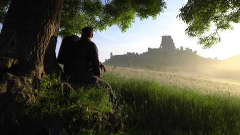 Walker-admiring-Corfe-Castle-at-sunrise