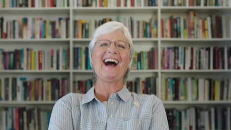 portrait-of-elegant-middle-aged-woman-teacher-laughing-cheerful-looking-at-camera-excited-elderly-lady-wearing-glasses-in-library