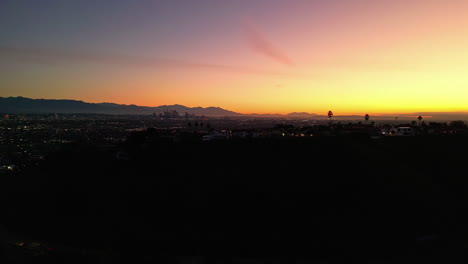 Los-Angeles-in-dawn-with-colorful-sky,-aerial-view-from-LA-view-point