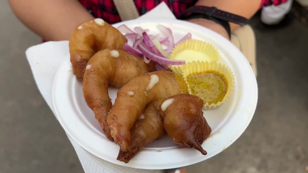 Deep fried prawn served with mayonese and kasundi in a road side stall in Kolkata.