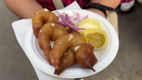 deep fried prawn served with mayonese and kasundi in a road side stall in kolkata.