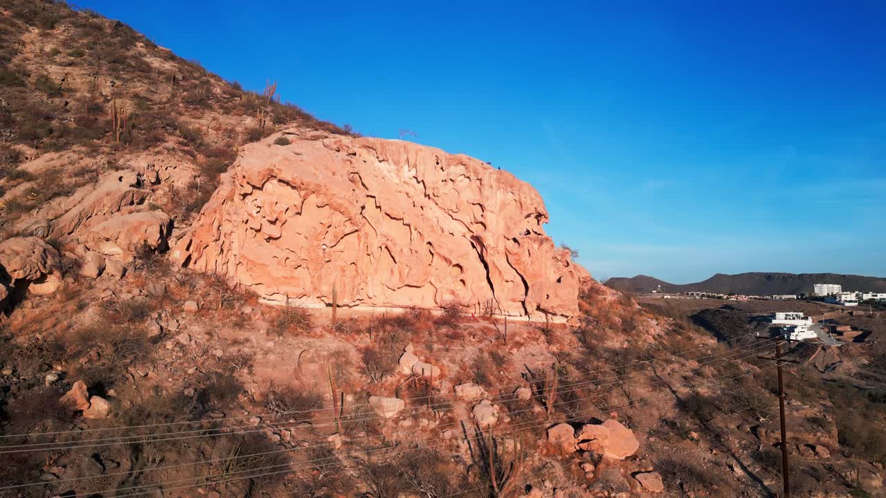 La Paz landscape with rugged hills, cactus, and a view of the Malecon Calavera area