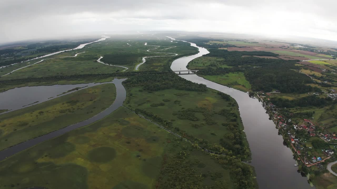 Drone, wide angle video of the floodplain wetlands of Lower Oder - cloudy day, slow forward movement