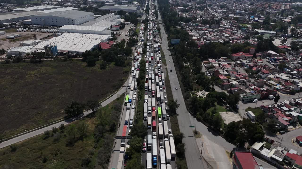 Aerial static drone footage showing severe traffic congestion in both directions on the Mexico–Querétaro Highway, located in the Mexico City metropolitan area, highlighting transport intensity