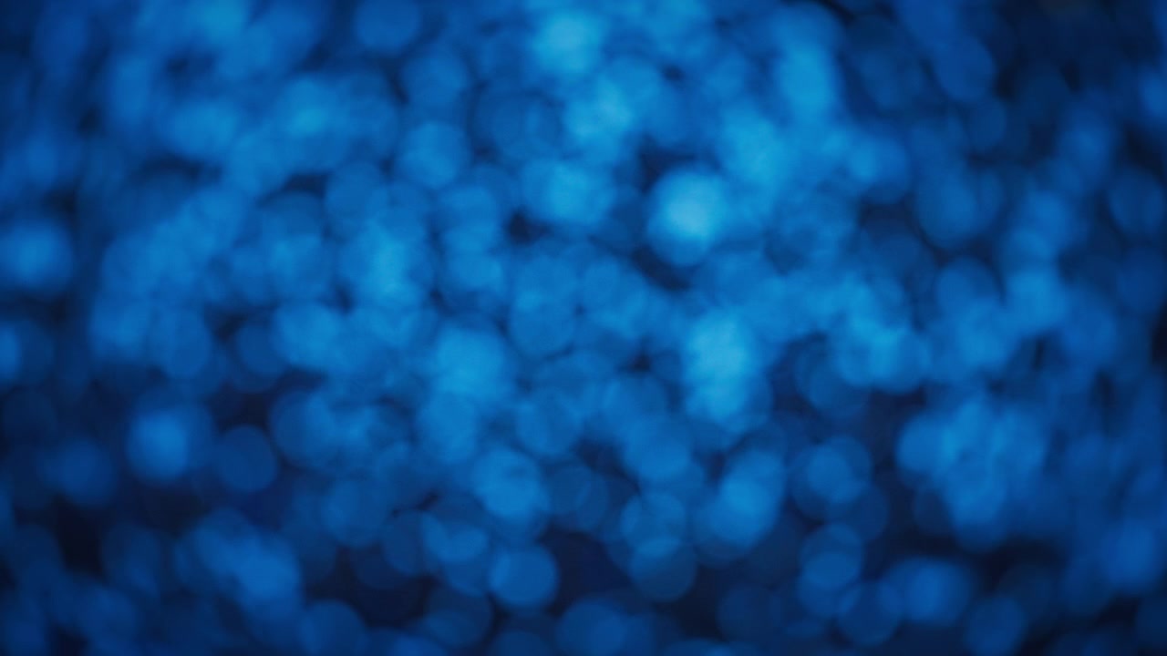 Sfondo bokeh di glitter blu con motivo cangiante.