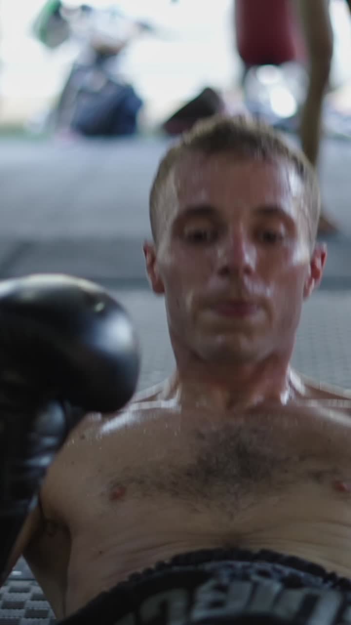 Man working out with boxing gloves