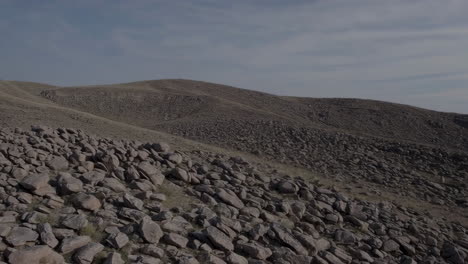 rocky mountain landscape with scattered boulders