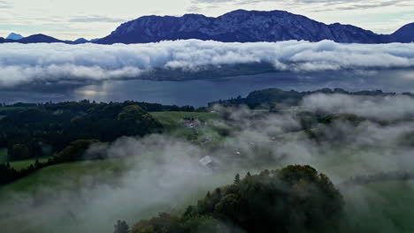 aerial view looking over lake attersee in austria, mountains in the background