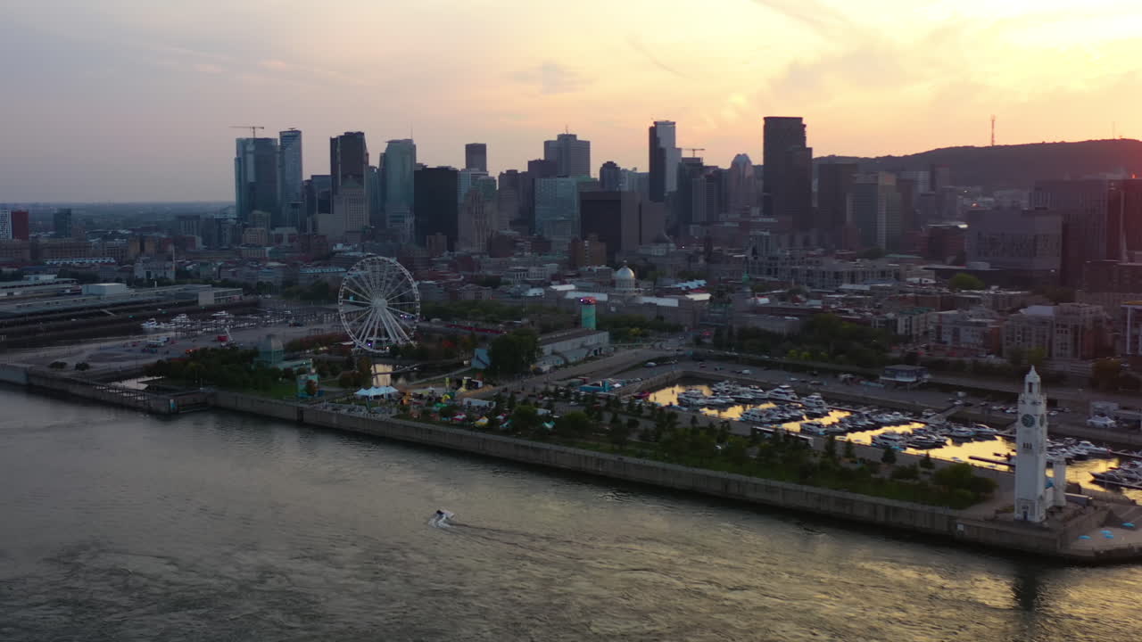 Panoramic drone shot of the waterfront of Montreal, sunny evening in Canada