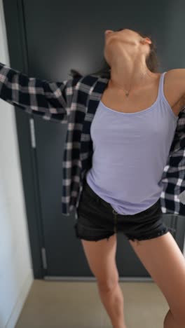 woman in plaid shirt and tank top