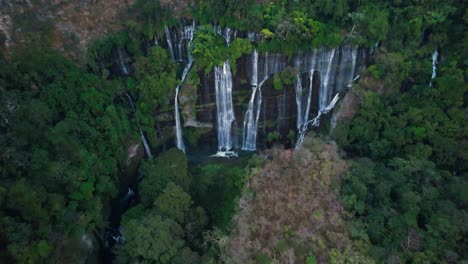 overhead-aerial-of-waterfall-in-Michoacán-Mexico-covered-by-very-green-forest-tree's