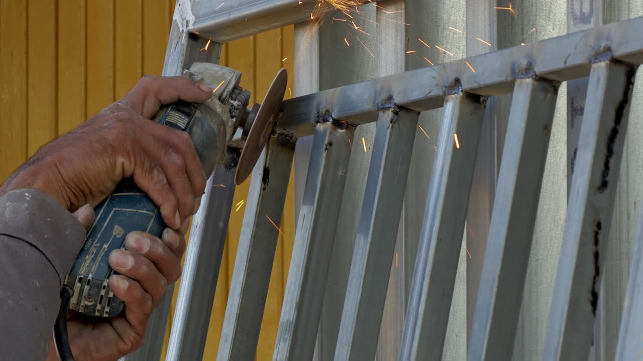A craftsman expertly cutting metal sparks illuminating workspace