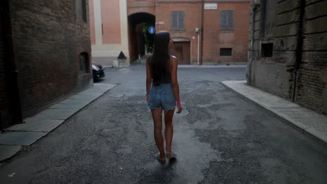 woman walking in an italian city street