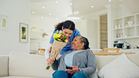 Sofa,-flowers-and-senior-woman-with-caregiver