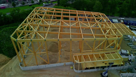 aerial drone overview of geometric wall house building skeleton frame paneling