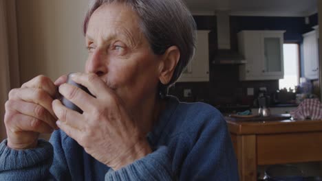 Senior-woman-relaxing-alone-at-home