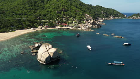 boats are moored near the shore of tanote bay, thailand