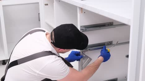 a young contractor for the assembly of kitchen furniture a young contractor for the assembly of kitchen furniture installation of furniture hinges on cabinet doors