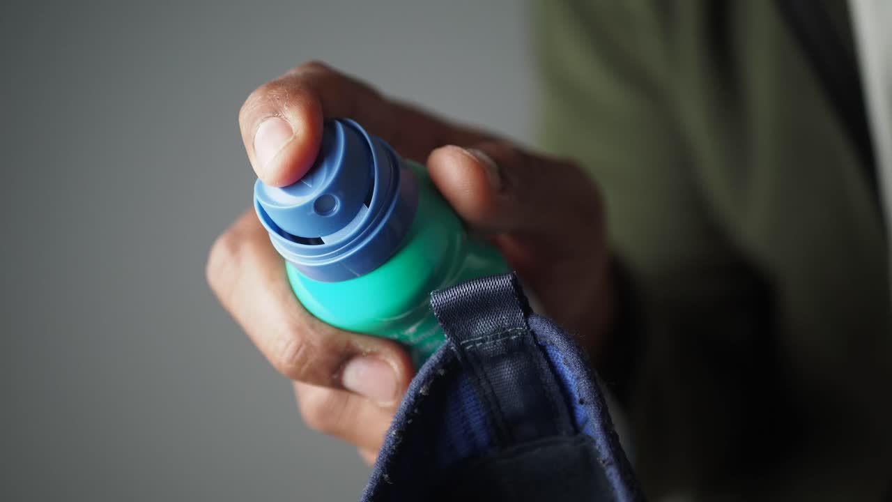Applying Spray to Clothes