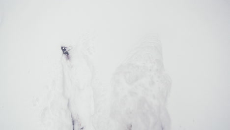 splitboarding walking steps on white powdery snow