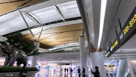 time-lapse of dinosaur exhibit in a bustling airport terminal.